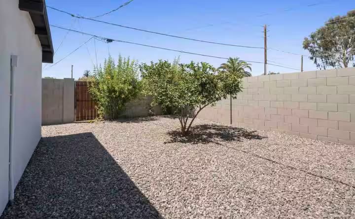 Modern All-En-Suite Home - Outdoor Dining Modern All-En-Suite Home outdoor dining at a direct-booking vacation rental in Phoenix, Arizona