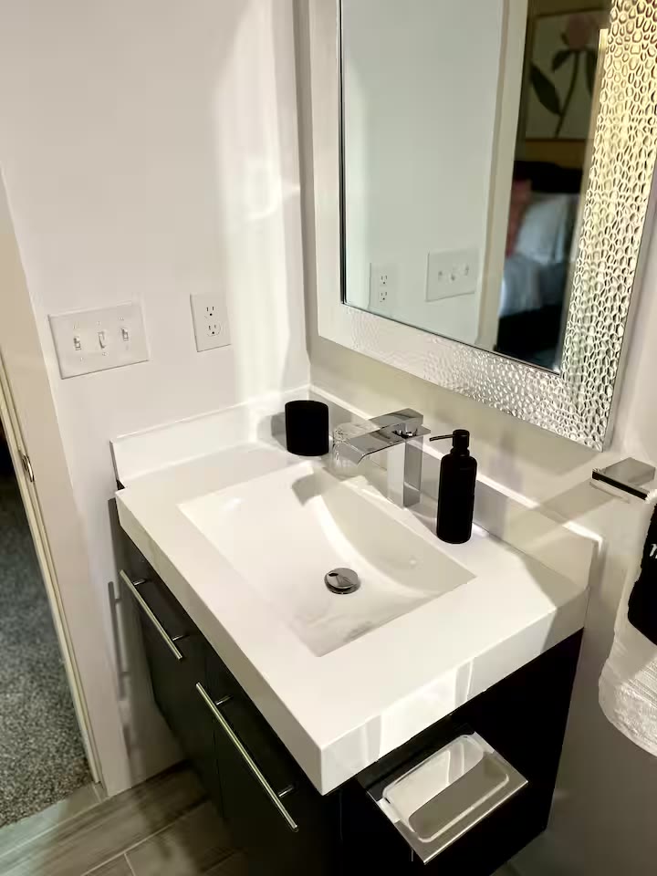 Modern All-En-Suite Home - Bathroom Shower Modern All-En-Suite Home bathroom shower at a direct-booking vacation rental in Phoenix, Arizona