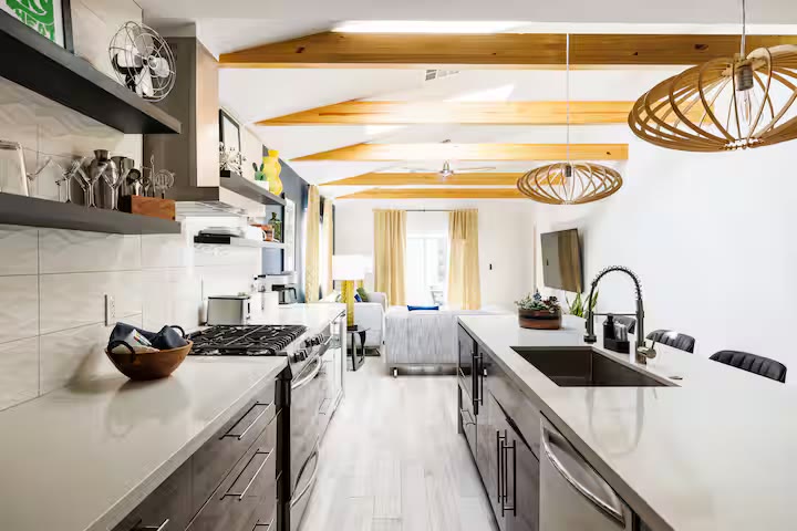 Modern All-En-Suite Home - Kitchen Island Seating Modern All-En-Suite Home kitchen island seating at a direct-booking vacation rental in Phoenix, Arizona