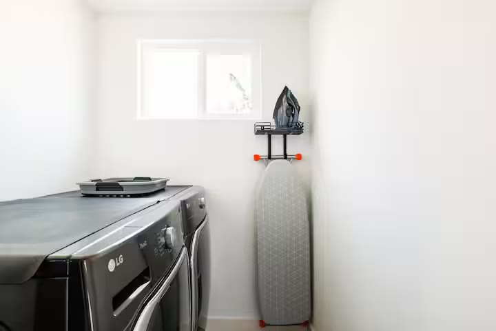 Modern All-En-Suite Home - Laundry Room Modern All-En-Suite Home laundry room at a direct-booking vacation rental in Phoenix, Arizona