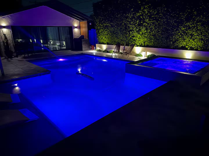 Palm Haven Pool House - Pool At Night Palm Haven Pool House pool at night at a direct-booking vacation rental in Phoenix, Arizona